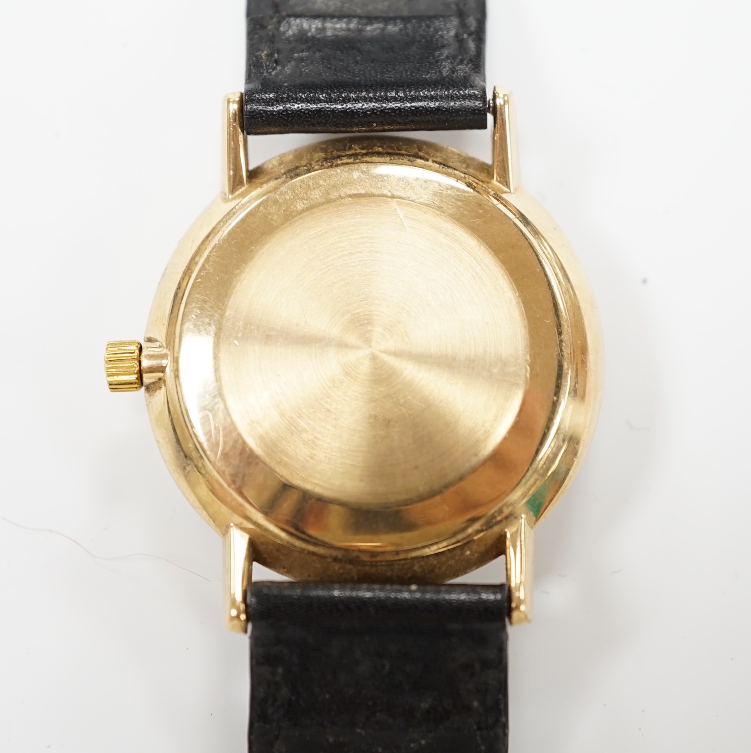 A gentleman's yellow metal Omega Seamaster De Ville manual wind wrist watch, on associated leather strap, case diameter 34mm, no box or papers.